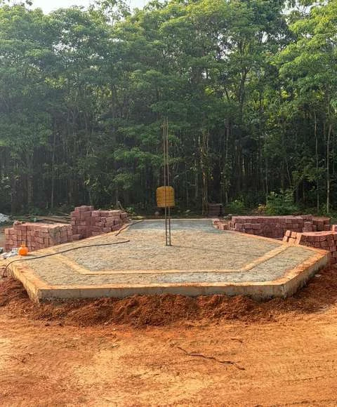 The shaped foundation base surrounded by trees